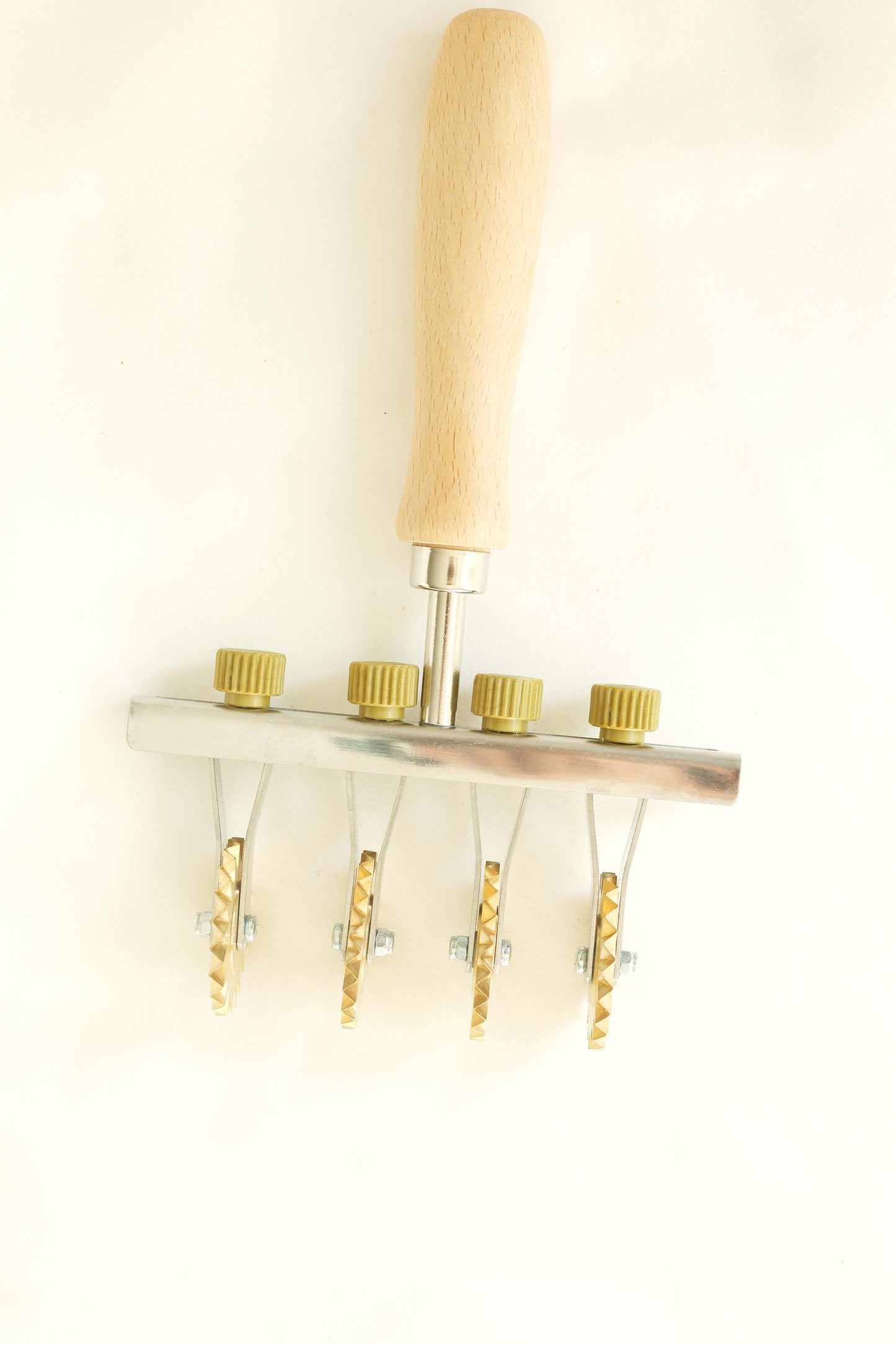Adjustable pasta cutter with 4 toothed brass wheels