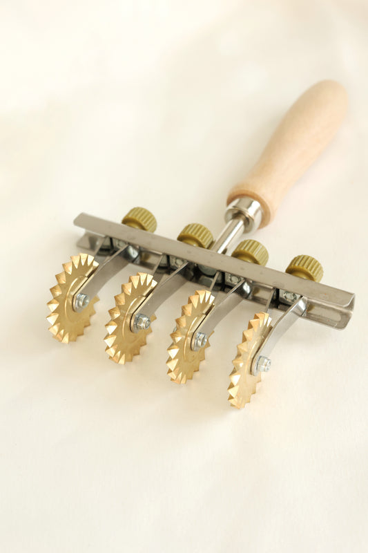 Adjustable pasta cutter with 4 toothed brass wheels