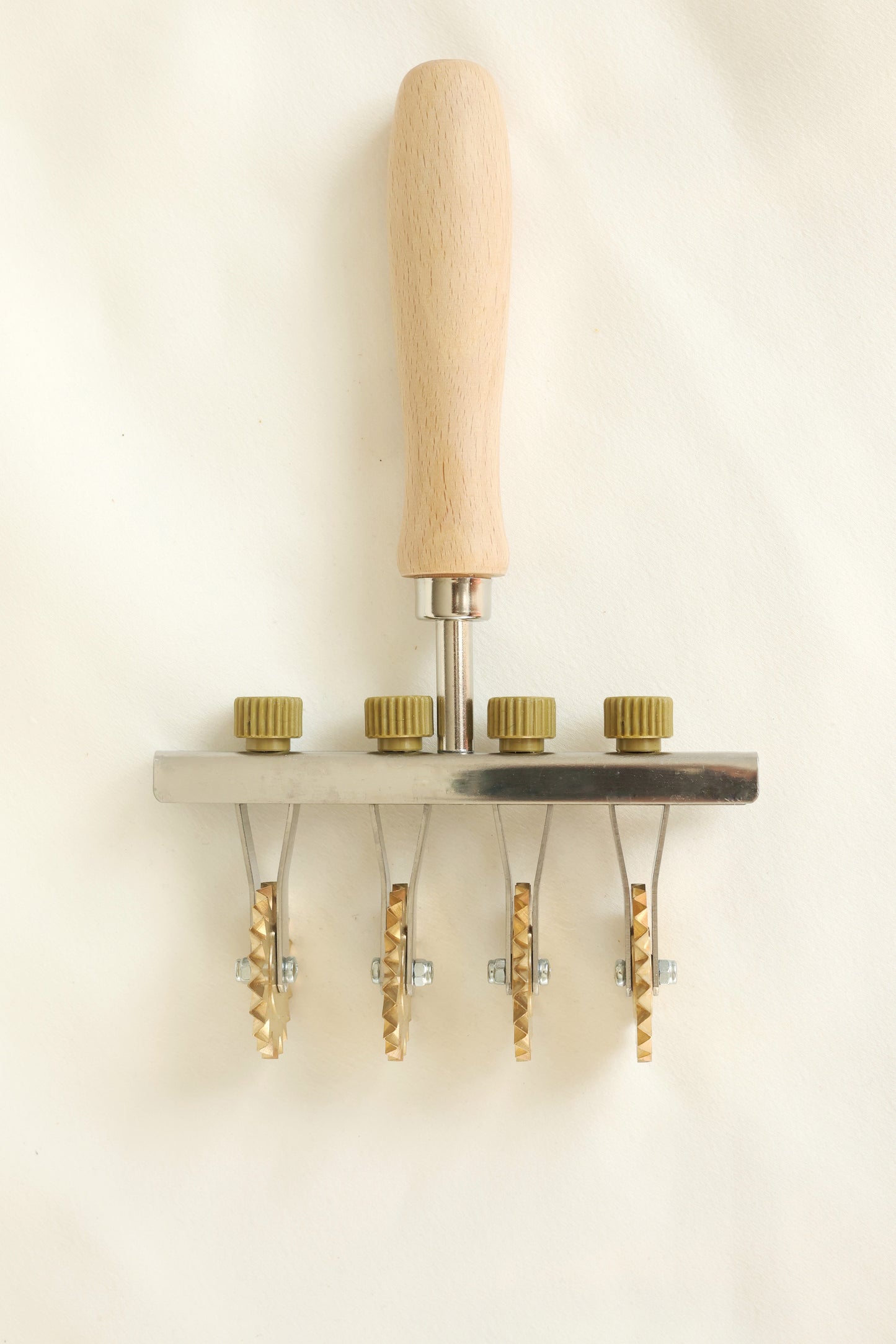 Adjustable pasta cutter with 4 toothed brass wheels